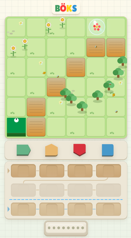 A BÖKS puzzle level with obstacles and command blocks